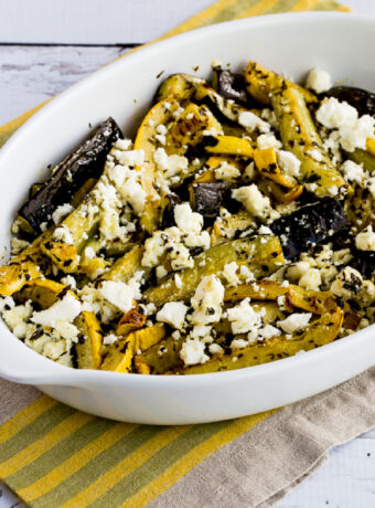 Baked Summer Squash with Lemon, Mint, and Feta in serving dish on napkin