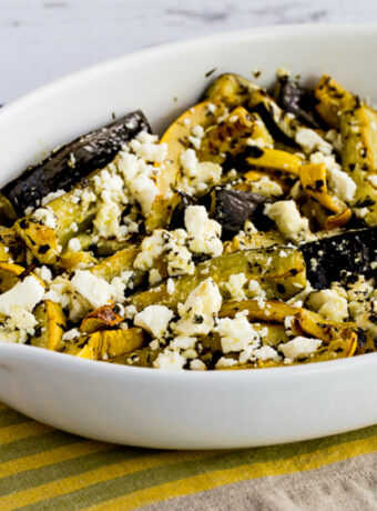 square photo of Baked Summer Squash with Lemon, Mint, and Feta in serving dish