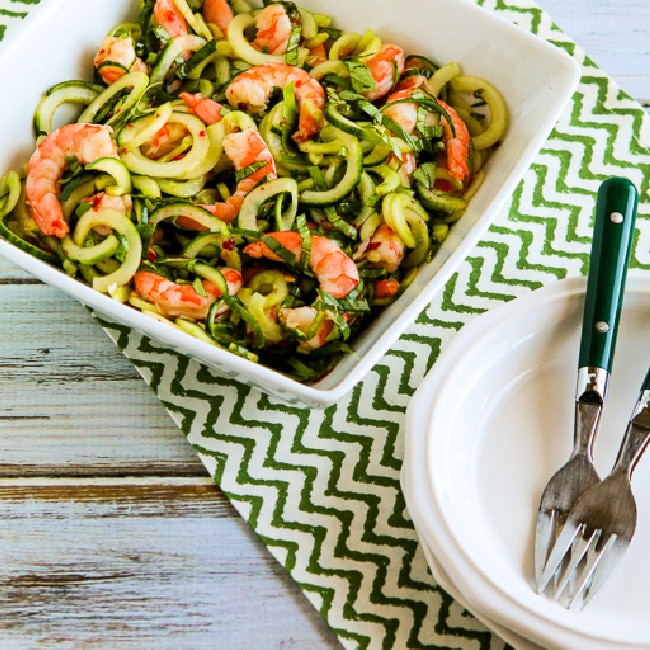 Cucumber Noodle Salad with Shrimp in serving bowl with plates and forks, thumbnail image