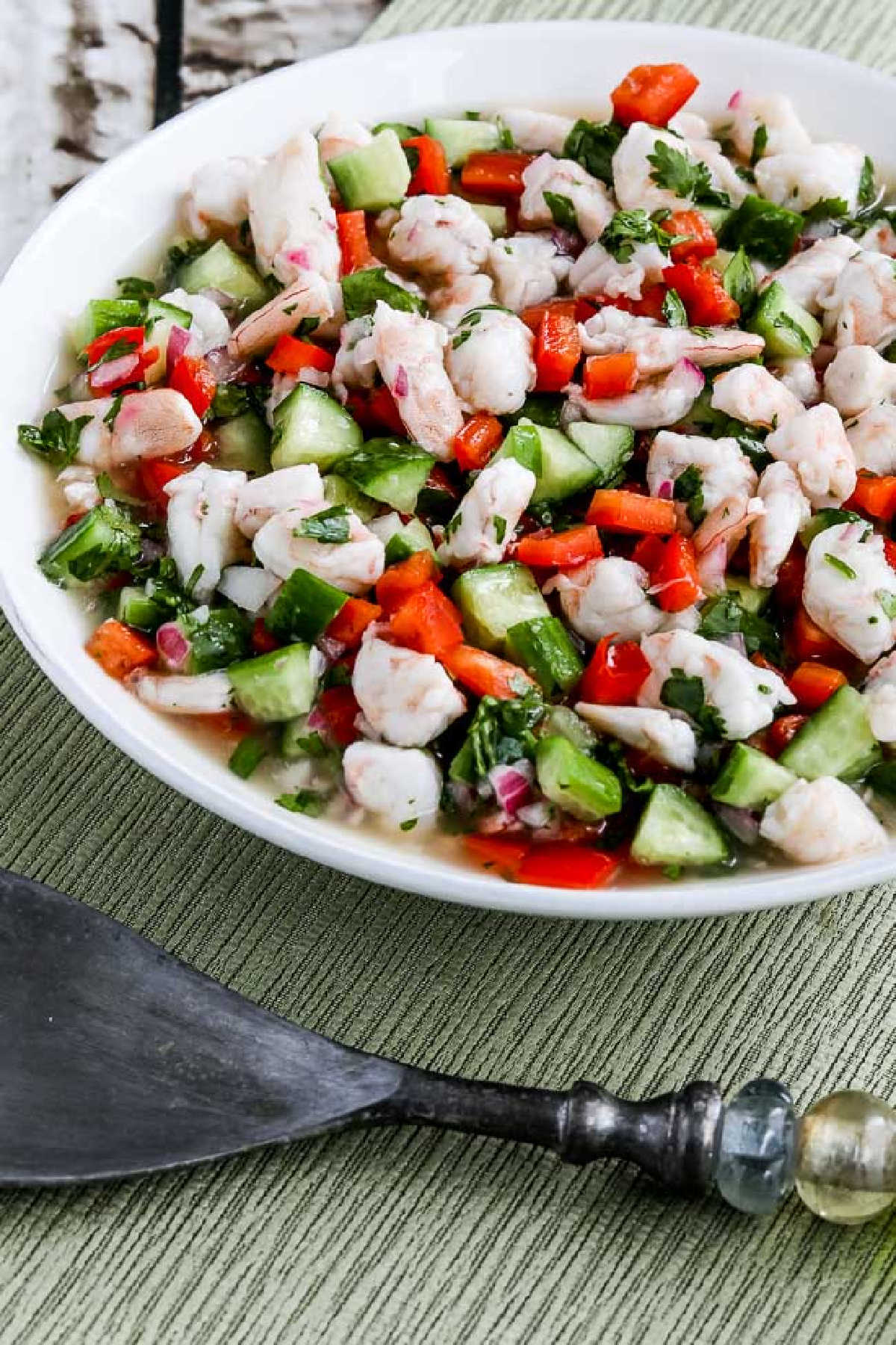 Easy Shrimp Ceviche Recipe shown in serving dish with serving fork