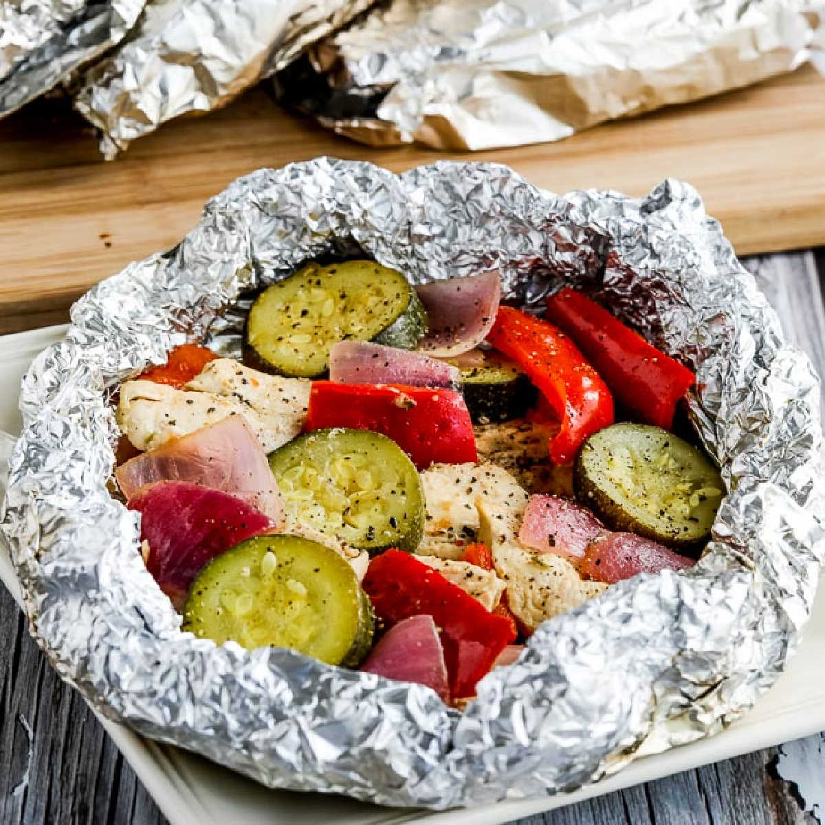 square image of Low-Carb Foil Packet Dinner with foil folded back to show ingredients