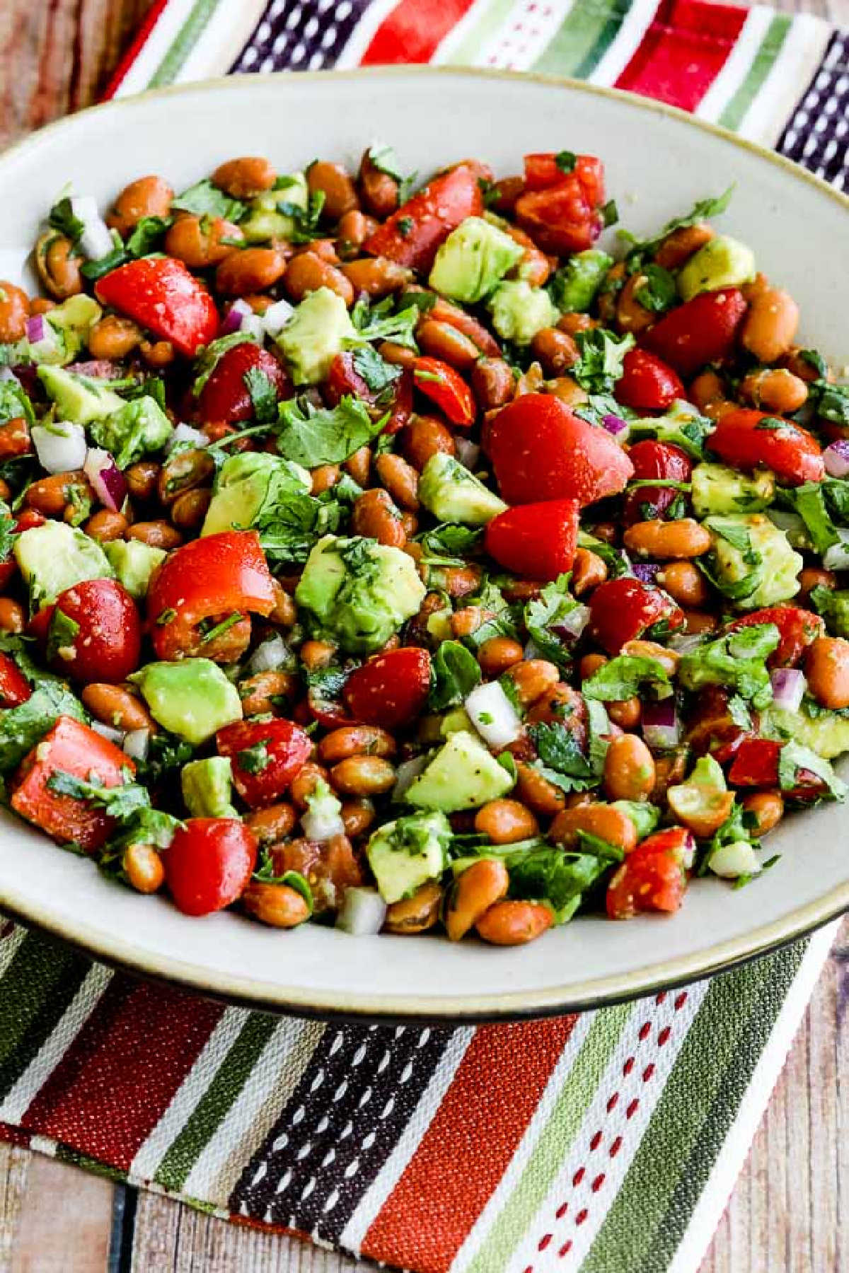 Pinto Bean Salad with Avocado and Tomatoes in serving bowl