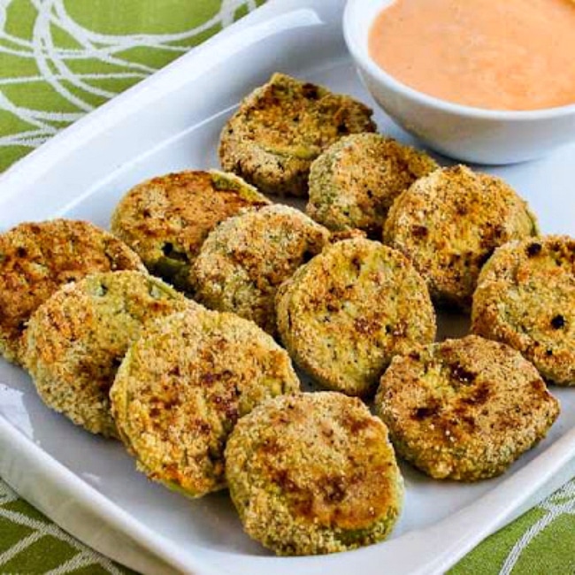 Oven-Fried Green Tomatoes with Sriracha-Ranch Dipping Sauce thumbnail image of fried green tomatoes on serving plate