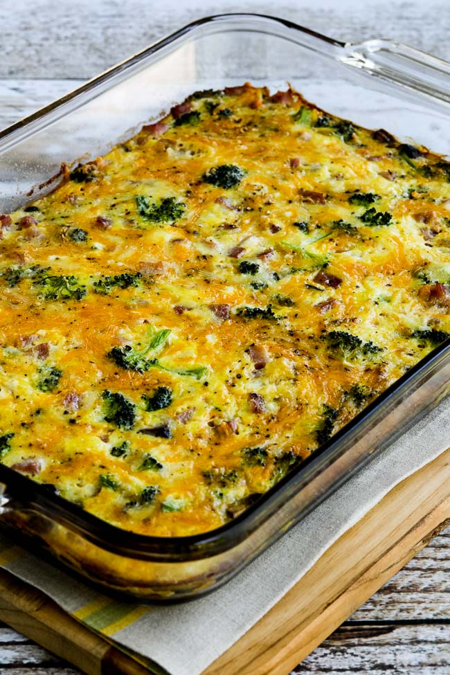 Broccoli, Mushrooms, Ham, and Cheddar Baked with Eggs shown in baking dish.