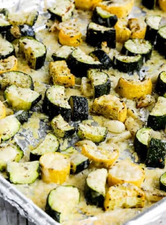 square photo of Roasted Summer Squash with Garlic and Parmesan on baking sheet