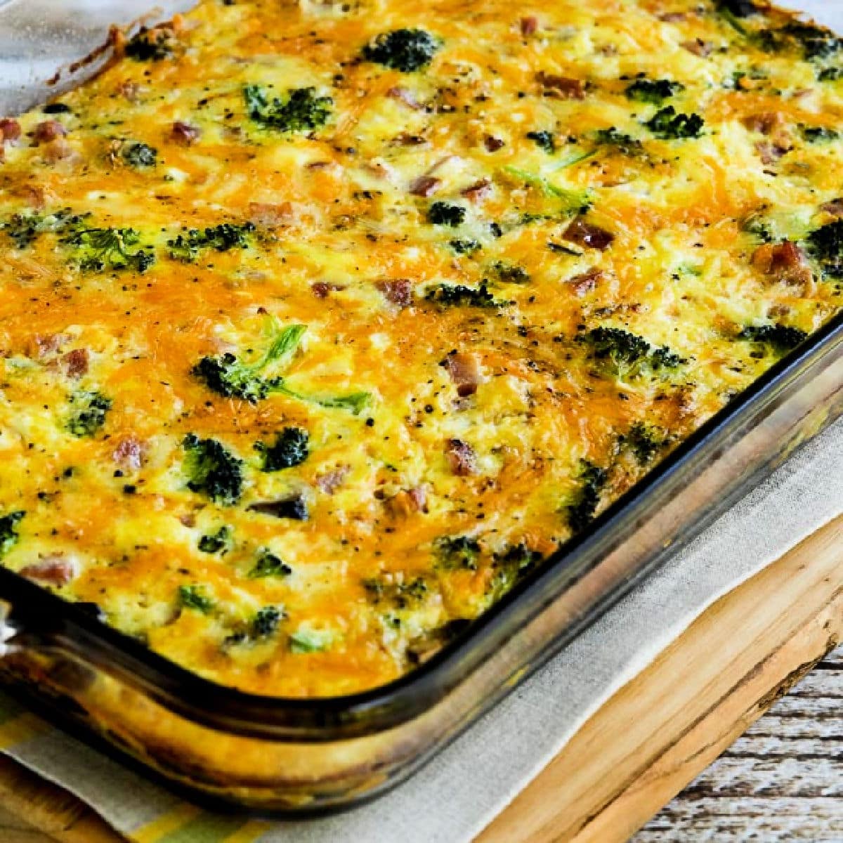 Low-Carb Breakfast Bake with Broccoli, mushrooms, ham, and cheddar shown in baking dish.