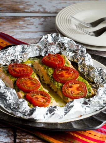 square image of Baked Salmon with Pesto and Tomatoes