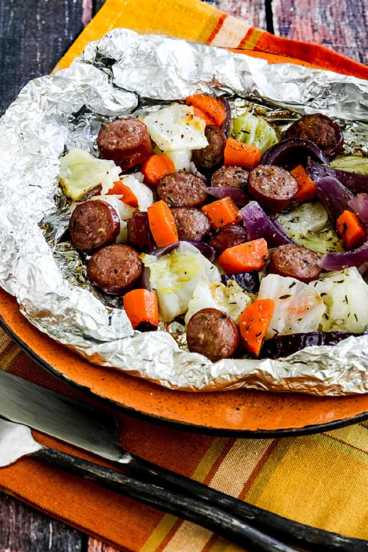 Autumn Tin Foil Dinners shown in foil on cutting board