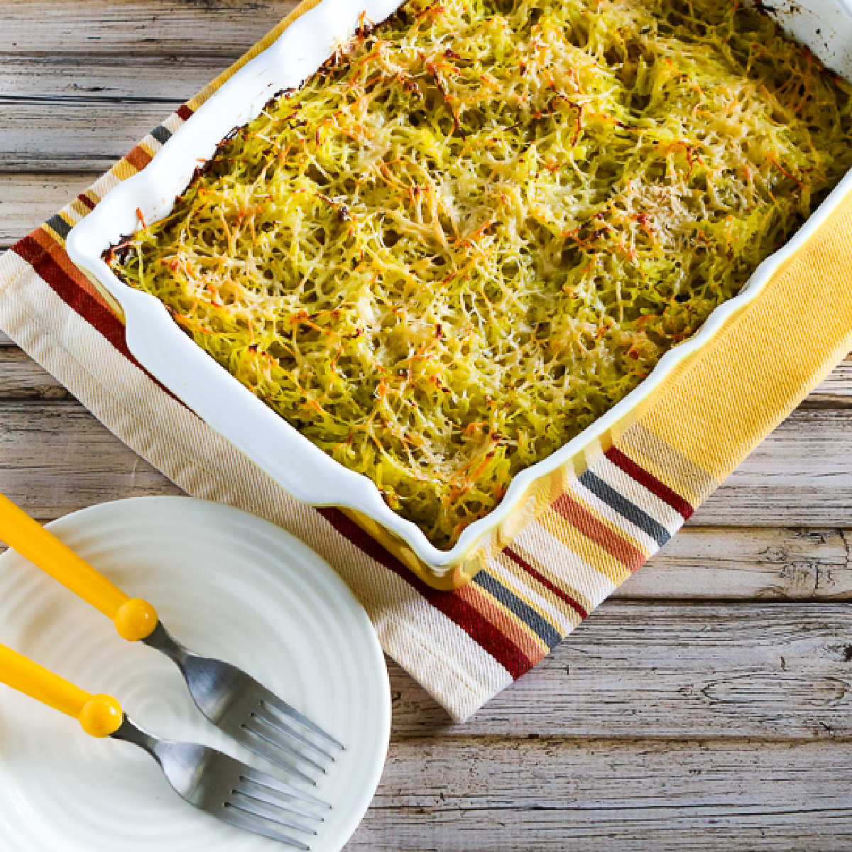 square image of Pesto Spaghetti Squash on baking dish