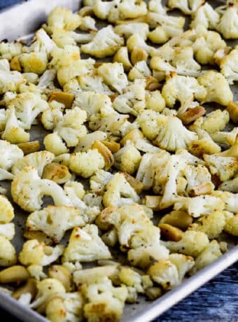 Roasted Cauliflower with Garlic shown on sheet pan