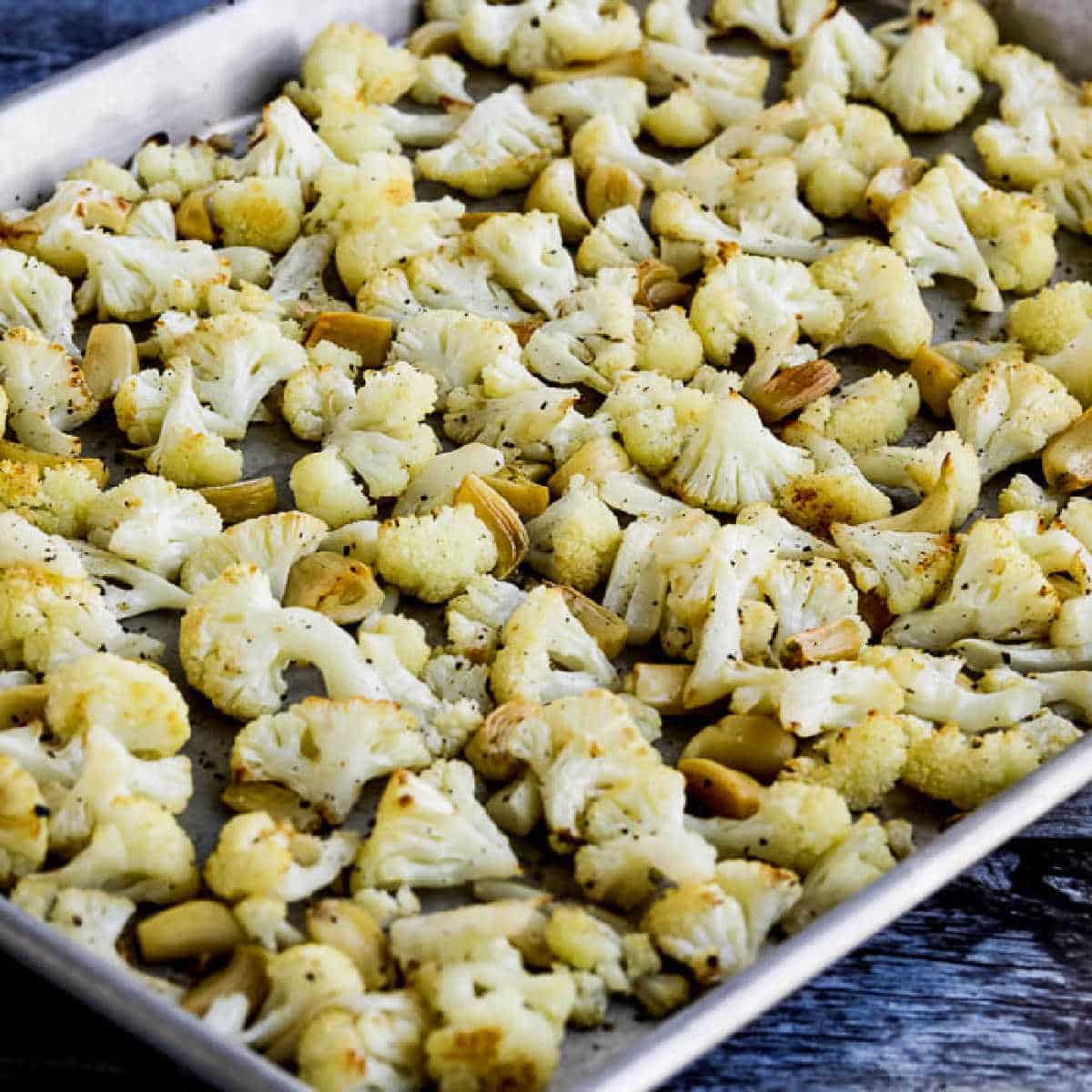 Roasted Cauliflower with Garlic shown on sheet pan