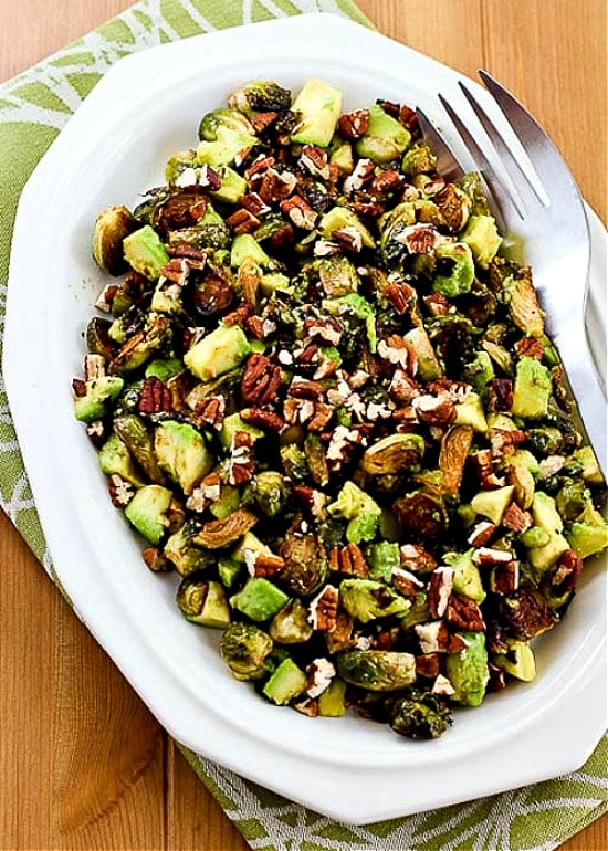 Roasted Brussels Sprouts with Avocados and Pecans photo of finished dish on serving plate