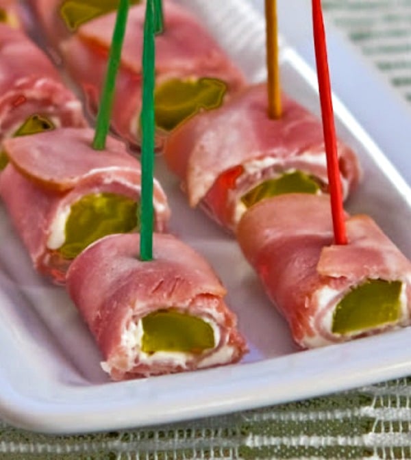 Ham and Dill Pickle Roll Ups shown on serving plate