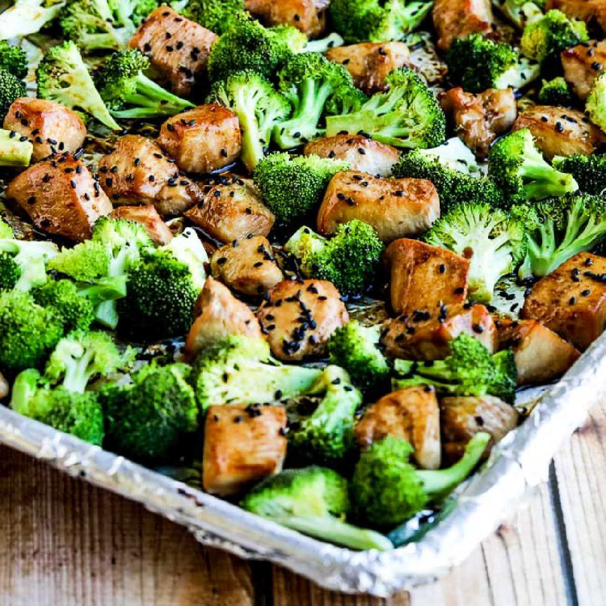 Sesame Chicken and Broccoli Sheet Pan Meal shown on sheet pan lined with foil.