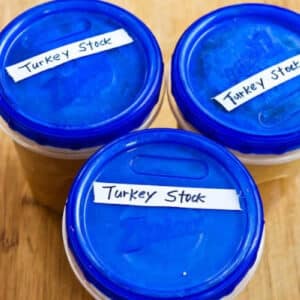 How to Make Turkey Stock showing stock in freezer containers