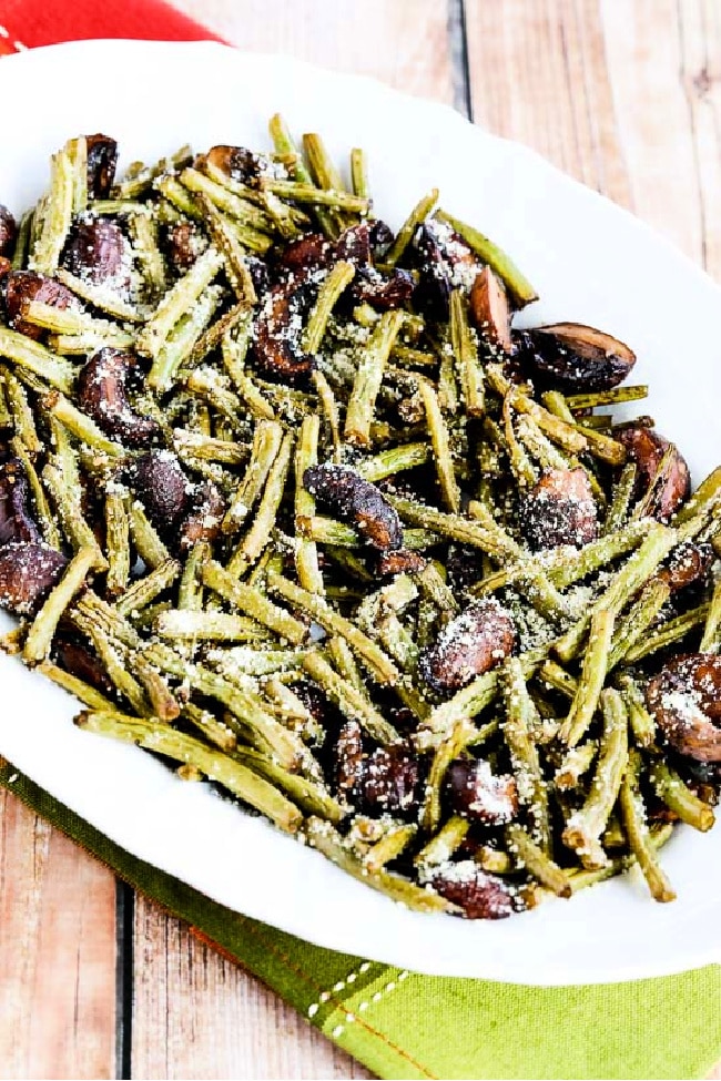 Roasted Green Beans with Mushrooms, Balsamic, and Parmesan close-up image of finished beans on serving plate