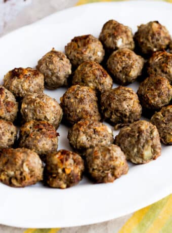 Square image for Baked Greek Meatballs with Feta shown on serving platter.