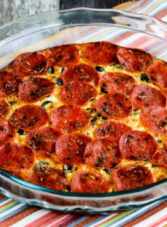 Pepperoni Pizza Keto Crustless Quiche shown in baking dish on napkin.