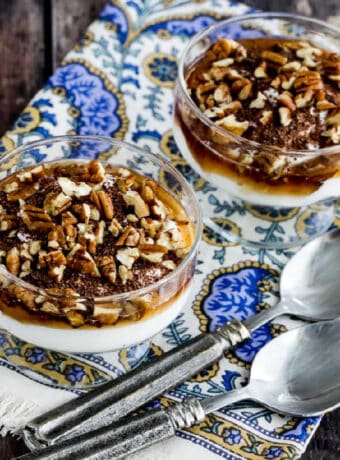 10 Minute Greek Yogurt Dessert in dessert glasses on colorful napkin