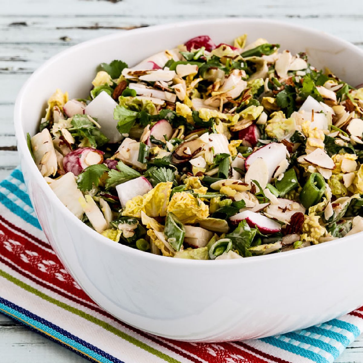 square image of Napa Cabbage Asian Slaw in serving bowl