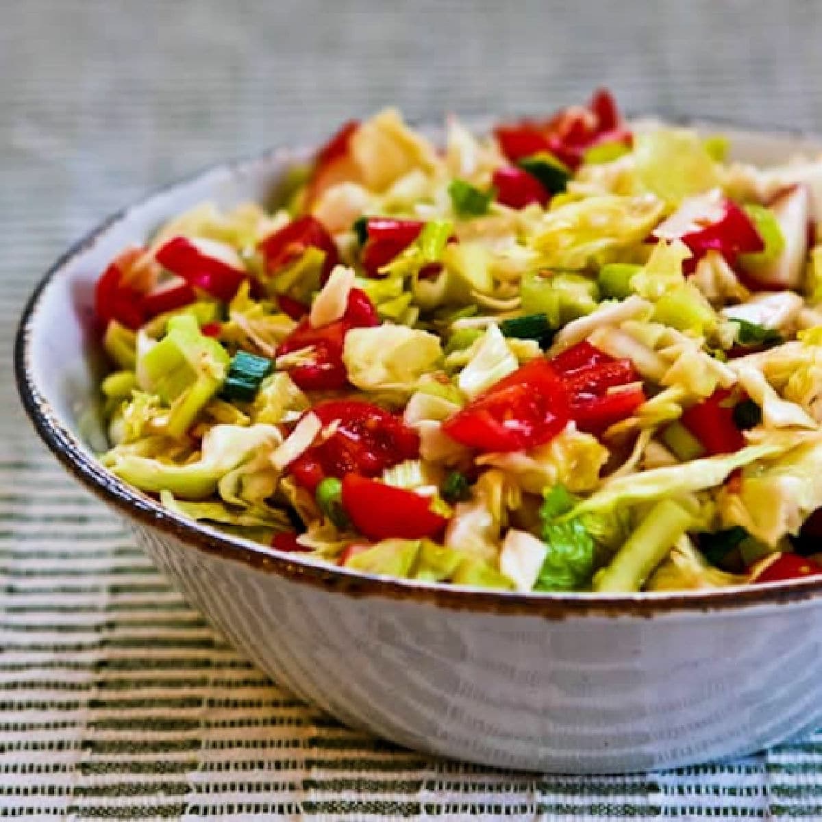 Square image of Spicy Cabbage Puerto Rican Salad in serving bowl.