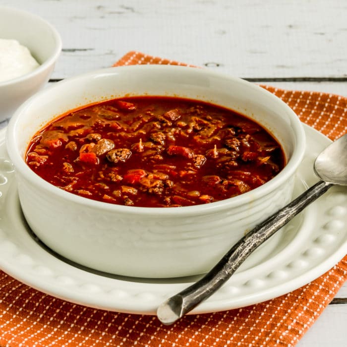 Goulash Soup square image of soup in serving bowl with spoon and plate