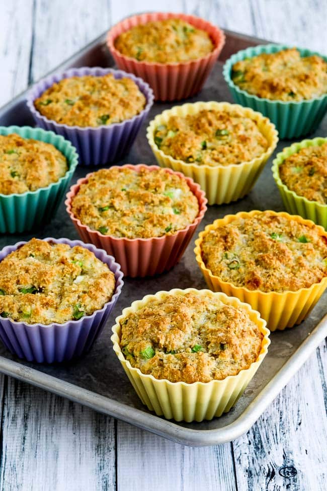 Low-Carb High-Fiber Savory Muffins shown in silicone baking cups on baking sheet.