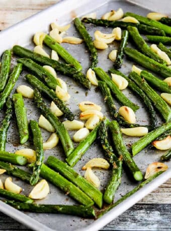 Square image of Roasted Asparagus with Garlic on sheet pan.