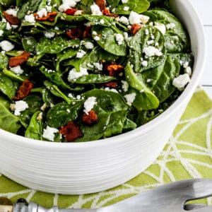 Spinach Salad with Bacon and Feta in serving dish with forks second photo
