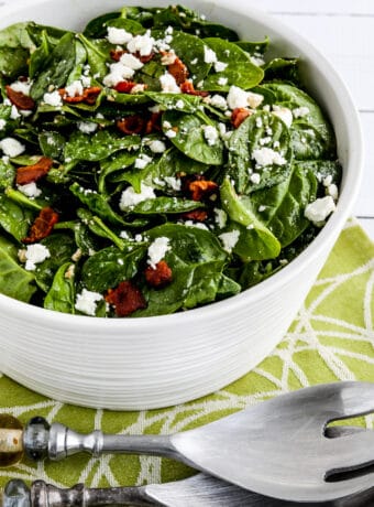 Spinach Salad with Bacon and Feta in serving dish with forks second photo