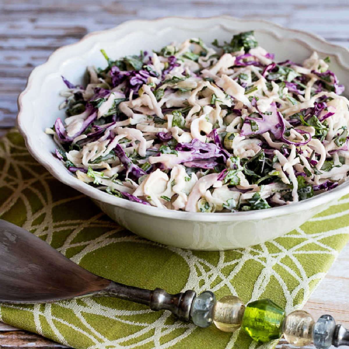 Spicy Mexican Slaw in serving bowl with fork.