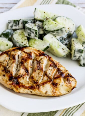 square image of Very Greek Grilled Chicken on serving plate with salad