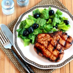 Grilled Ginger-Soy Pork Chops square image of pork chops on serving plate.