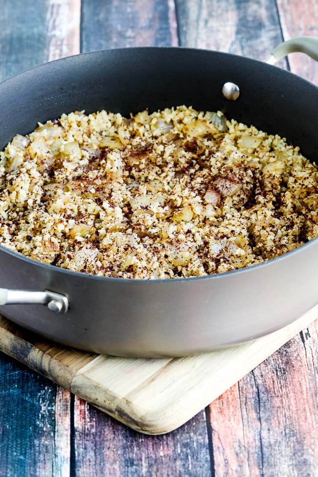 Spicy Cauliflower Rice shown in pan sprinkled with Sumac