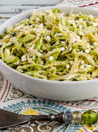 square image of Greek Cabbage Salad in serving bowl