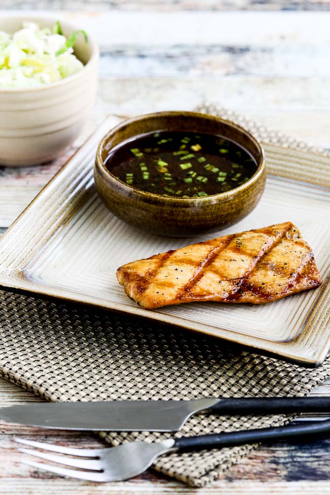 Grilled Mahi Mahi with Korean Dipping Sauce on serving plate with bowl of sauce