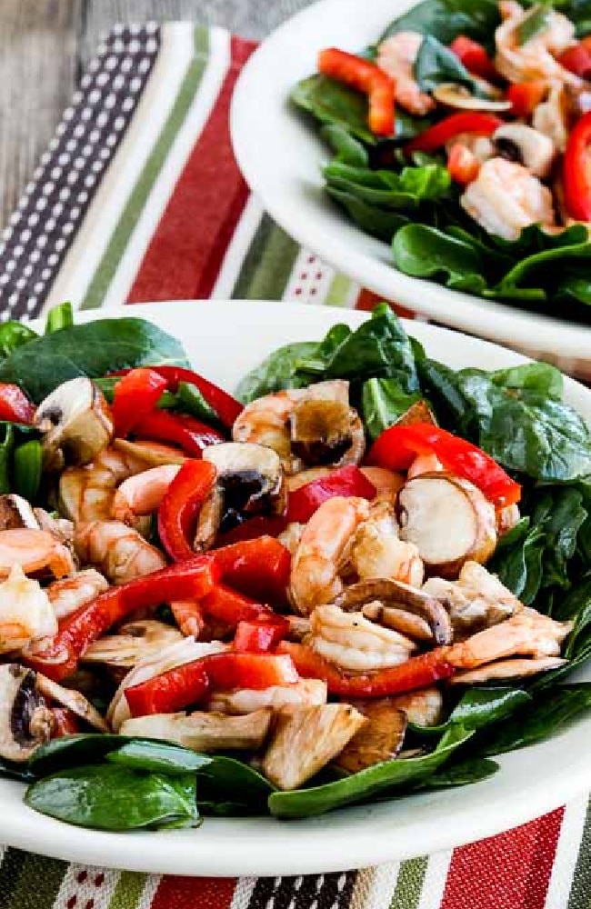 Spinach Salad with Shrimp shown in two serving owls