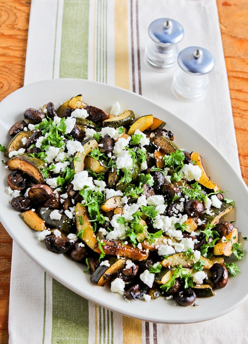 Roasted Zucchini and Mushrooms with Feta shown on serving plate on napkin