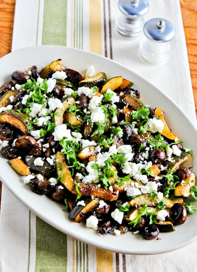 Roasted Zucchini and Mushrooms with Feta close-up photo of zucchini on serving dish