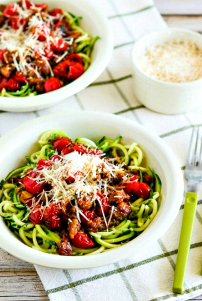 Zucchini Noodles with Spicy Cherry Tomato, Sausage, Garlic, and Herb Sauce close-up image