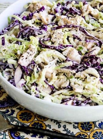 Square image of Chicken Cabbage Salad with Mustard shown on napkin.