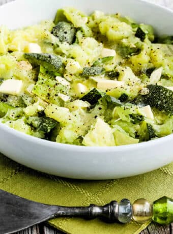 Square image of Green Spaghetti Squash cooked as a summer squash, shown in serving dish.
