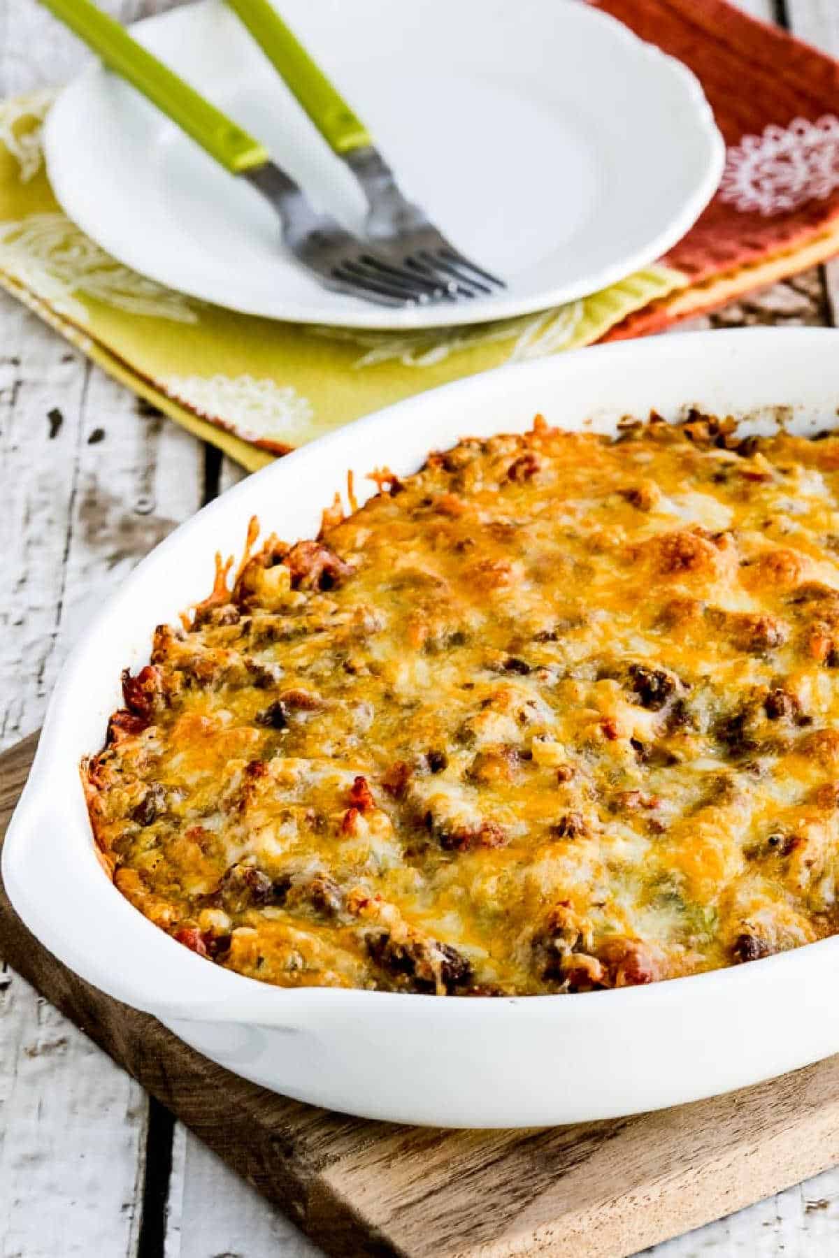 Cheesy Low-Carb Taco Casserole in baking dish shown on napkin