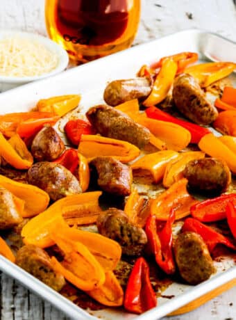 Square image for Roasted Italian Sausage and Mini Peppers Sheet Pan Meal shown on baking sheet.