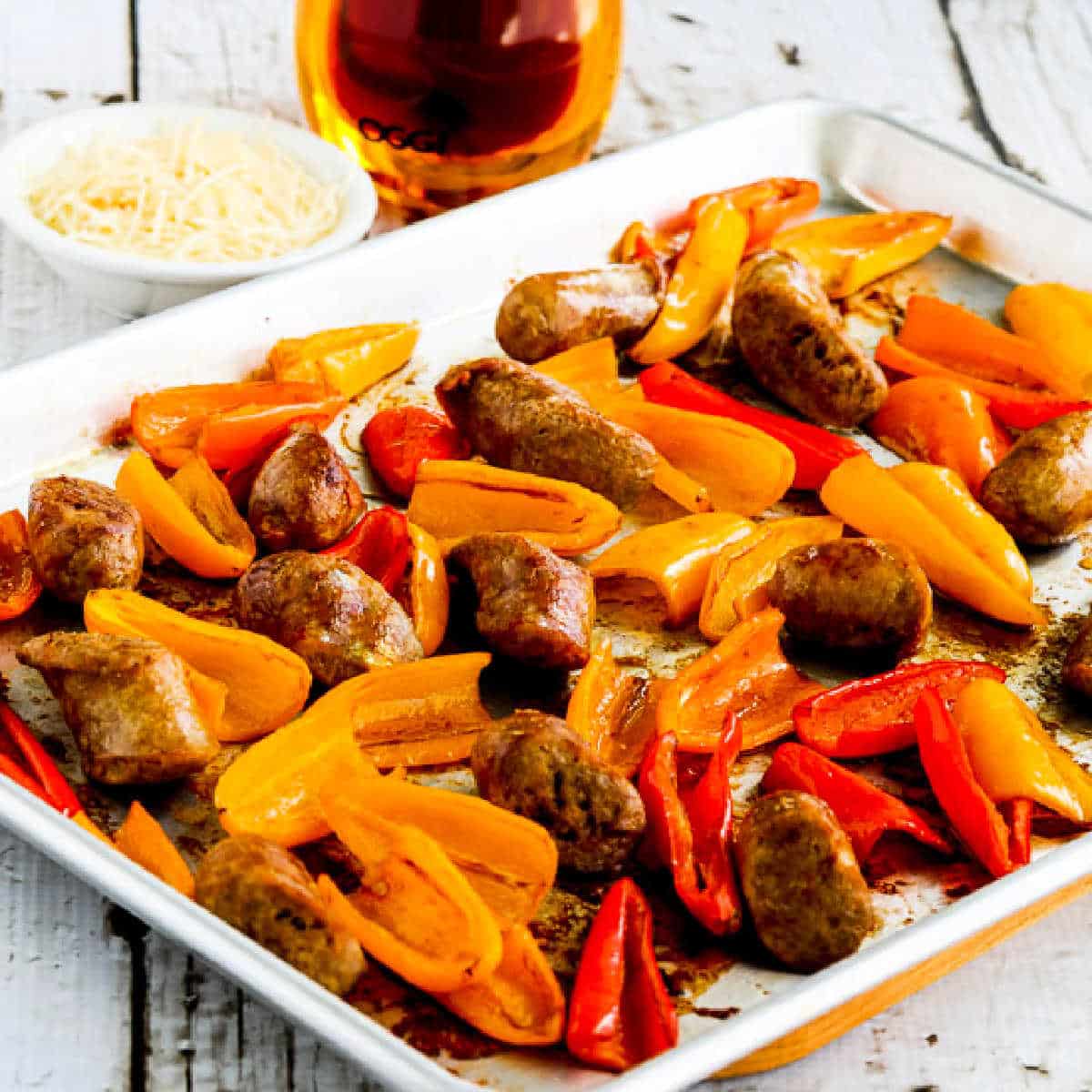 Square image for Roasted Italian Sausage and Mini Peppers Sheet Pan Meal shown on baking sheet.