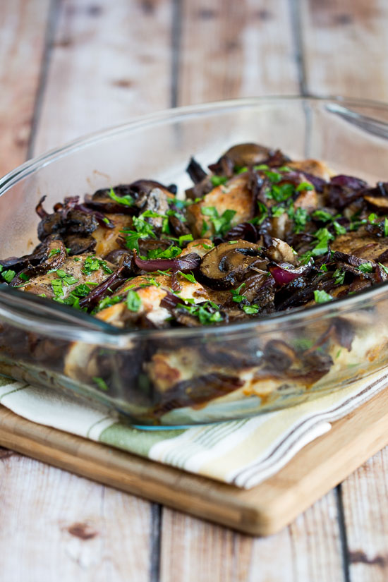Roasted Chicken Thighs with Onions, Mushrooms, and Rosemary shown in baking dish