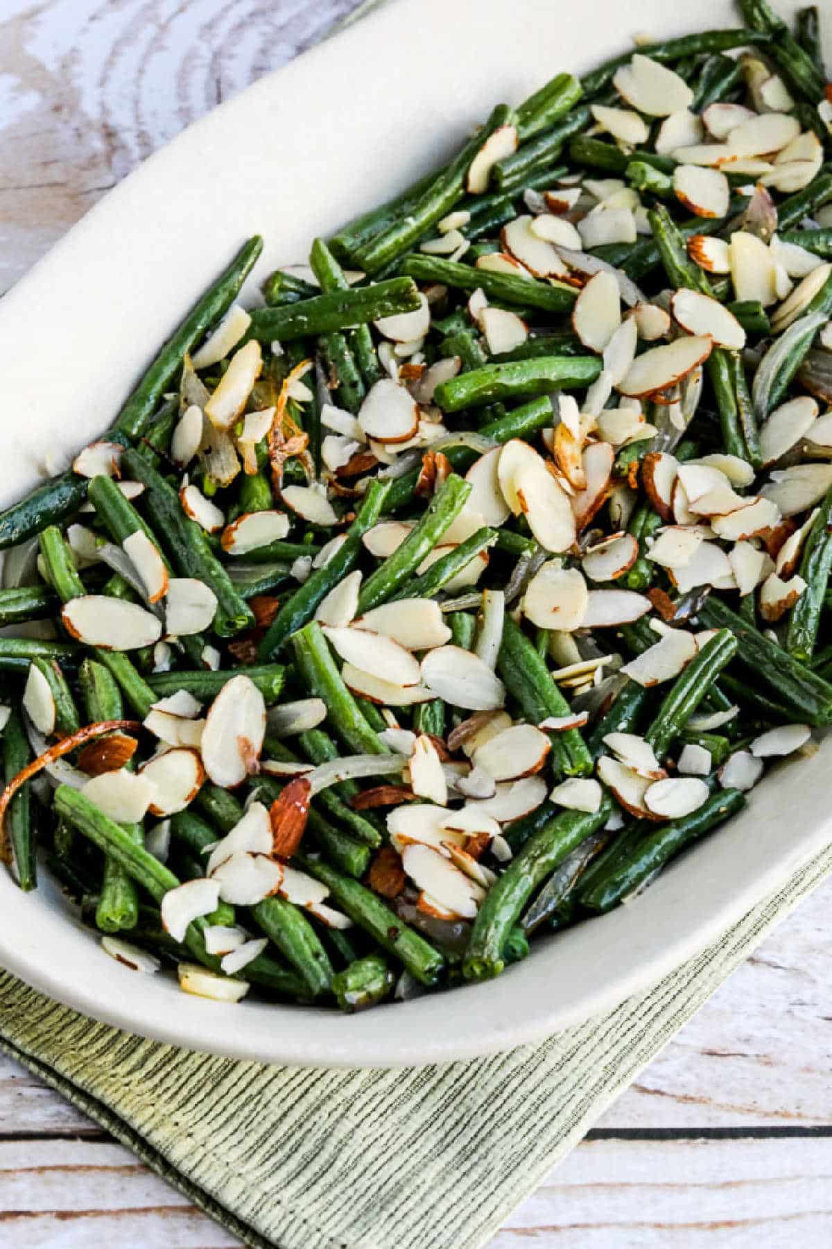 Garlic-Roasted Green Beans with Shallots and Almonds shown on serving platter