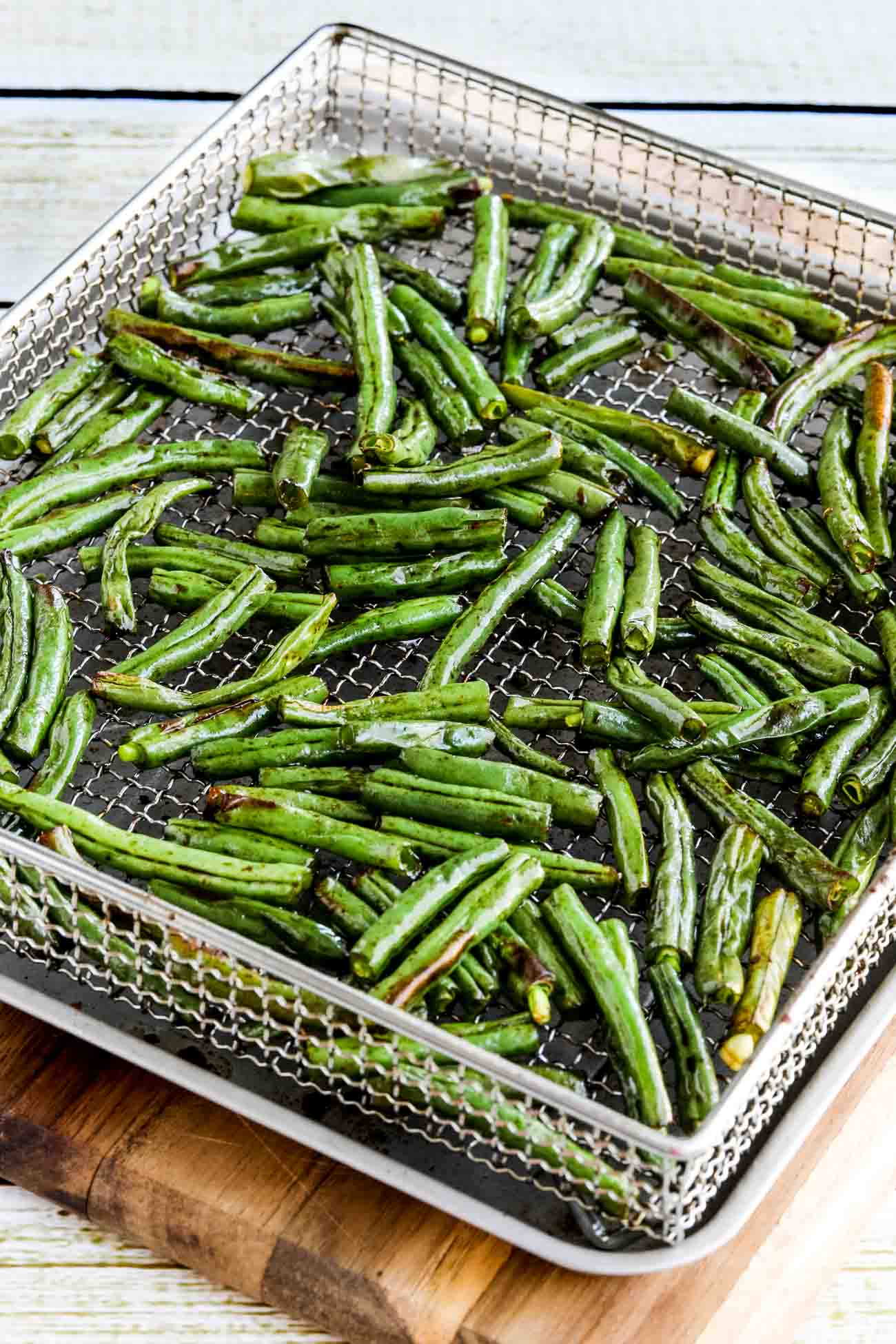 Air Fryer Asian Green Beans shown in air fryer basket