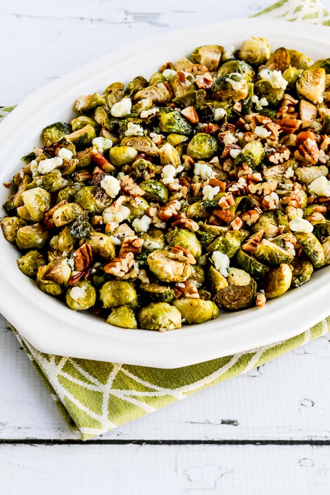Roasted Brussels Sprouts with Pecans and Gorgonzola shown on serving plate