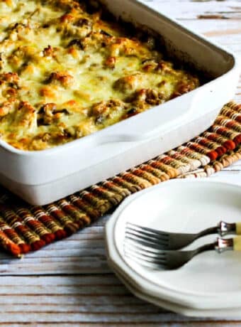 Low-Carb Turkey Casserole in baking dish with plates, forks